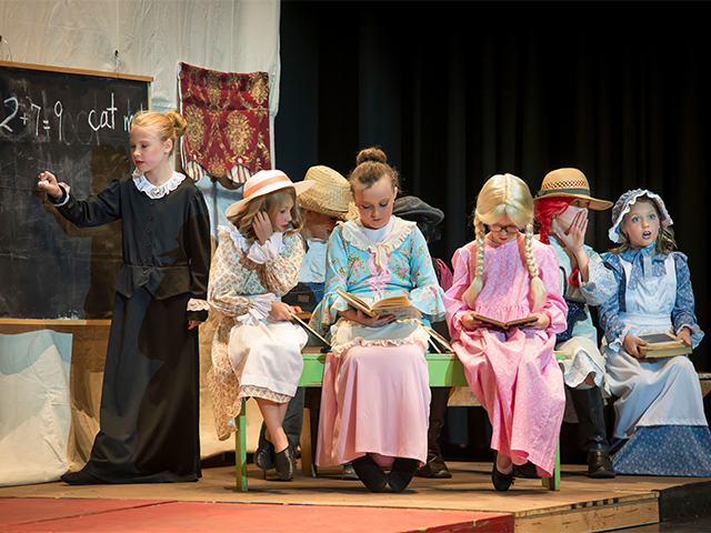 girls acting in an original play