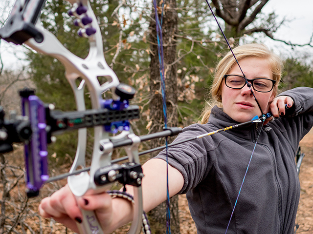 Girl shooting archery